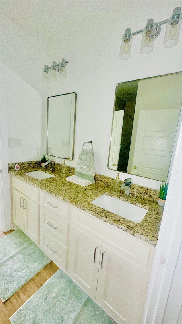 1418 S Martin St, Little Rock, AR 72204 - full bath featuring wood finished floors and double vanity