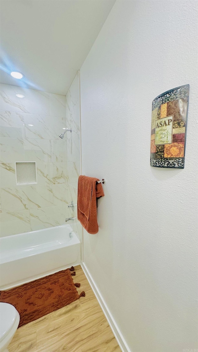 1418 S Martin St, Little Rock, AR 72204 - full bathroom featuring toilet, shower / bathtub combination, wood finished floors, and baseboards