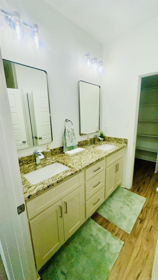 1418 S Martin St, Little Rock, AR 72204 - full bathroom featuring wood finished floors and double vanity