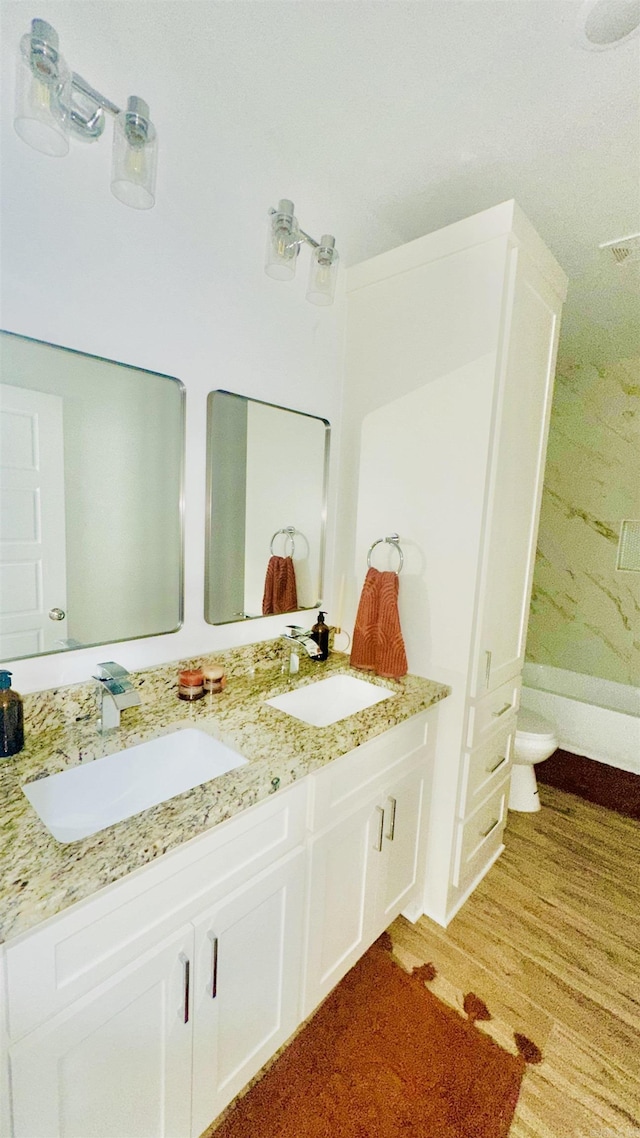1418 S Martin St, Little Rock, AR 72204 - bathroom featuring double vanity and wood finished floors