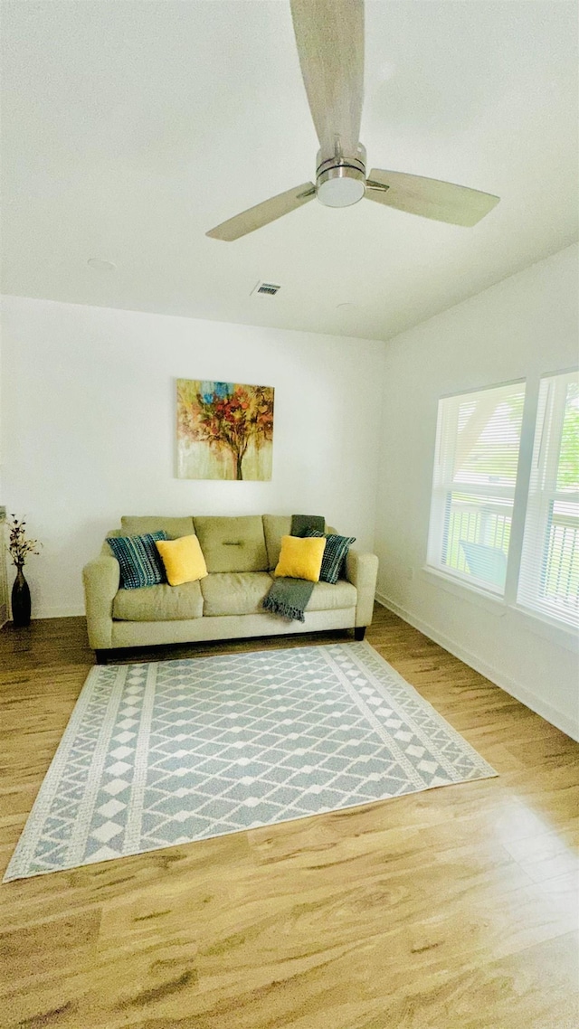 1418 S Martin St, Little Rock, AR 72204 - living room with wood finished floors, ceiling fan, and baseboards