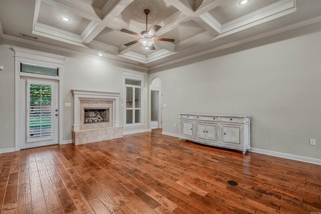 26 Kanis Creek Pl, Little Rock, AR 72223 - unfurnished living room with hardwood / wood-style flooring, a tiled fireplace, a ceiling fan, coffered ceiling, and ornamental molding