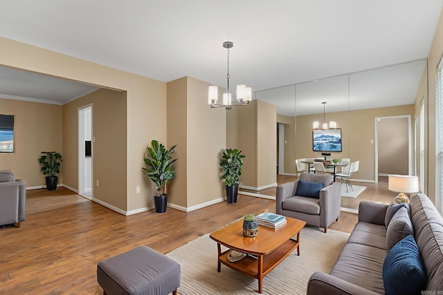 3017 Delmar Ave, North Little Rock, AR 72116 - living room with a chandelier, light wood-type flooring, baseboards, and crown molding