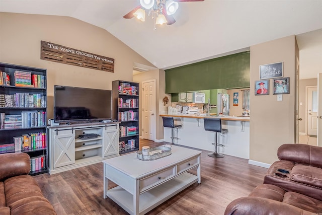 43 Juanita Cv, Lonoke, AR 72086 - living room with lofted ceiling, ceiling fan, dark wood finished floors, and baseboards