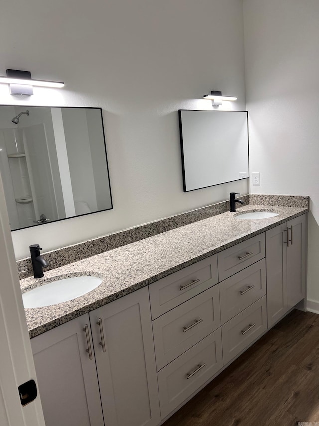 509 Algood St, Benton, AR 72015 - full bathroom with double vanity and wood finished floors