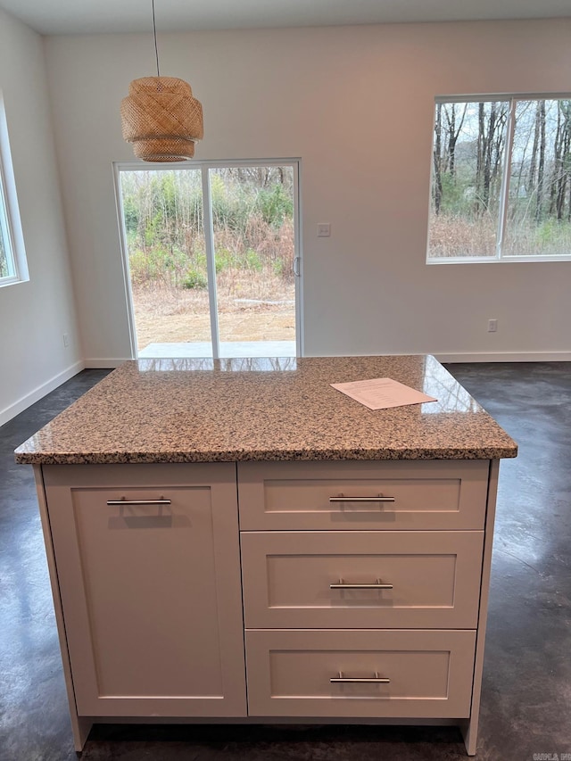 509 Algood St, Benton, AR 72015 - kitchen featuring plenty of natural light, concrete floors, and light stone counters