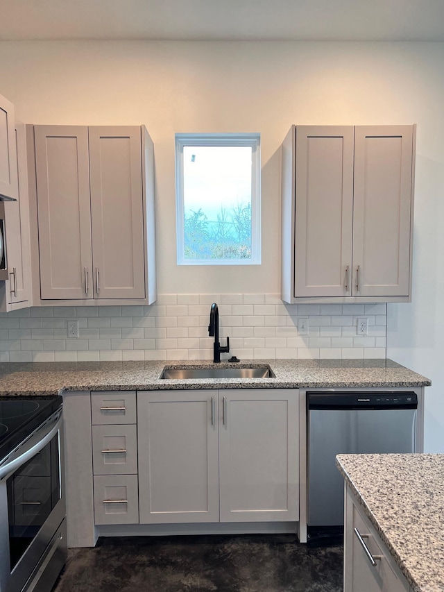509 Algood St, Benton, AR 72015 - kitchen with a sink, appliances with stainless steel finishes, decorative backsplash, and gray cabinets