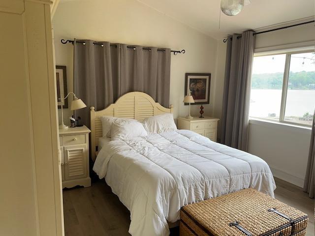 1803 Fairwater Cir, Horseshoe Bend, AR 72512 - bedroom with lofted ceiling and wood finished floors