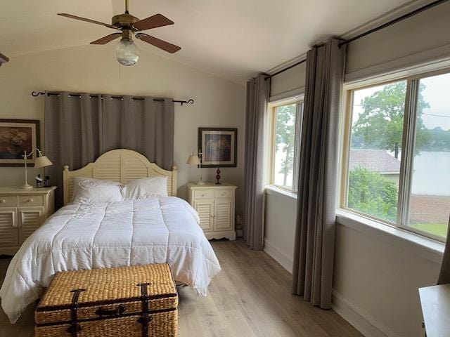 1803 Fairwater Cir, Horseshoe Bend, AR 72512 - bedroom with vaulted ceiling, baseboards, light wood-style floors, and a ceiling fan