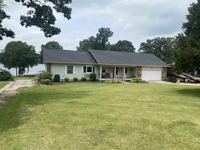 1803 Fairwater Cir, Horseshoe Bend, AR 72512 - ranch-style house with a porch, a garage, board and batten siding, a front yard, and driveway