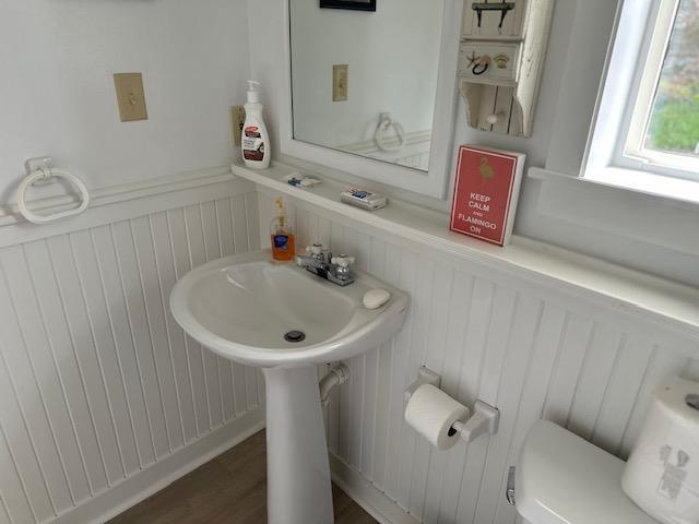 1803 Fairwater Cir, Horseshoe Bend, AR 72512 - bathroom featuring toilet and a wainscoted wall