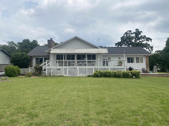 1803 Fairwater Cir, Horseshoe Bend, AR 72512 - rear view of property with a yard, a chimney, board and batten siding, and a wooden deck