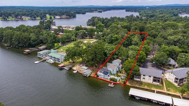 aerial view of property's location with a large body of water and property parcel outlined