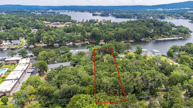 view of property location with property boundaries highlighted and a nearby body of water