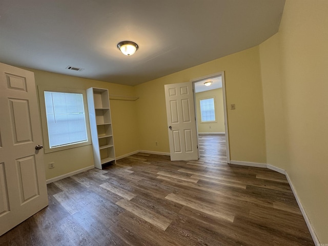 1316-1318 W 13th St, Little Rock, AR 72202 - unfurnished bedroom featuring dark wood-style floors, baseboards, and a closet