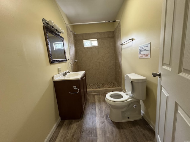 1316-1318 W 13th St, Little Rock, AR 72202 - full bathroom with toilet, vanity, a stall shower, wood finished floors, and baseboards