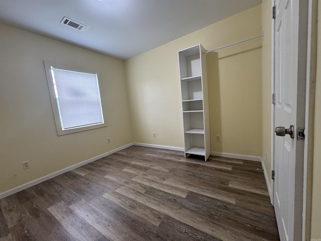 1316-1318 W 13th St, Little Rock, AR 72202 - unfurnished bedroom featuring dark wood-type flooring and baseboards