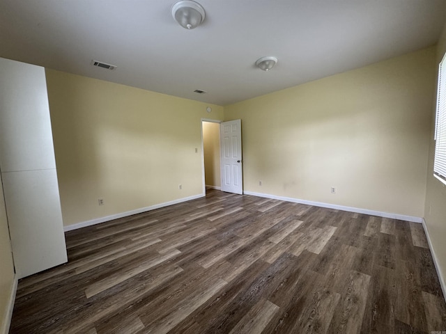 1316-1318 W 13th St, Little Rock, AR 72202 - spare room featuring dark wood-type flooring and baseboards
