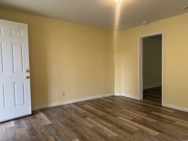 1316-1318 W 13th St, Little Rock, AR 72202 - empty room featuring dark wood-type flooring and baseboards