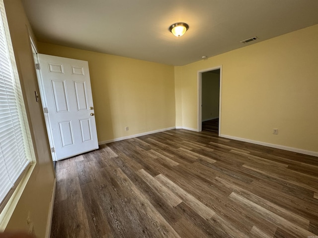 1316-1318 W 13th St, Little Rock, AR 72202 - spare room with dark wood-type flooring and baseboards