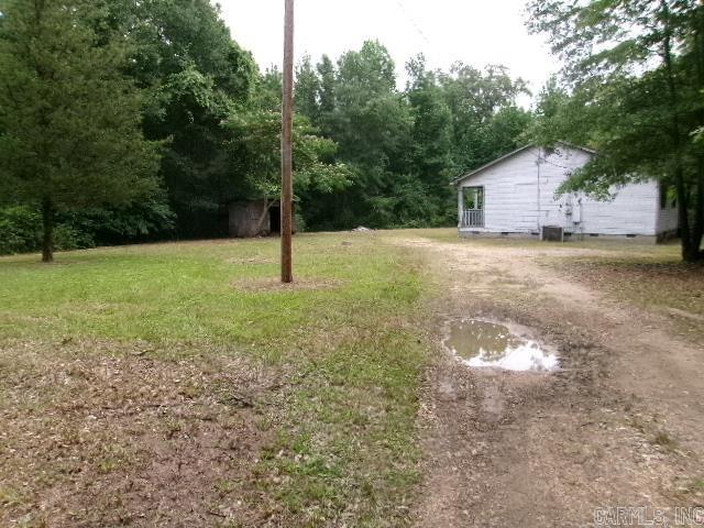 112 Huckleberry Ln, Monticello, AR 71655 - view of yard with driveway