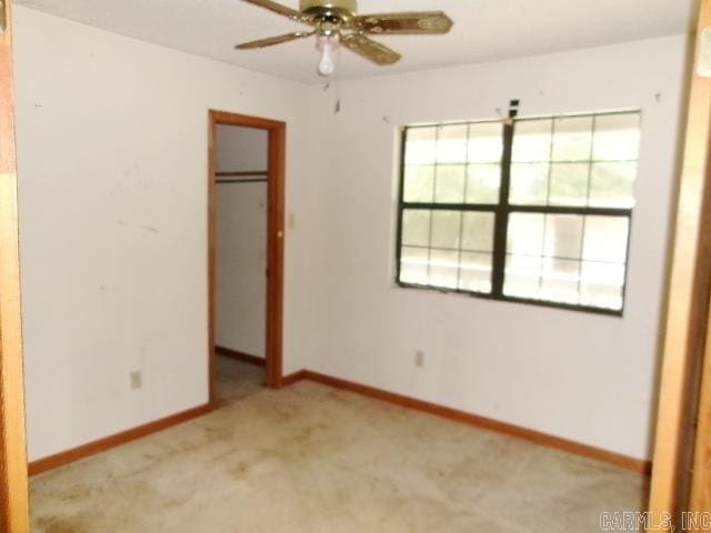 112 Huckleberry Ln, Monticello, AR 71655 - unfurnished bedroom with a closet, carpet flooring, baseboards, and a walk in closet