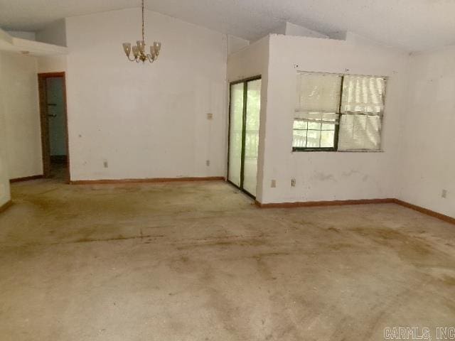 112 Huckleberry Ln, Monticello, AR 71655 - spare room with vaulted ceiling, a chandelier, and baseboards
