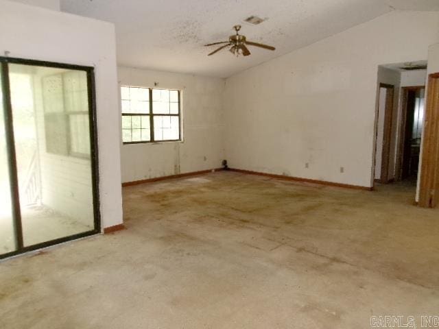 112 Huckleberry Ln, Monticello, AR 71655 - spare room with lofted ceiling, ceiling fan, concrete floors, and baseboards