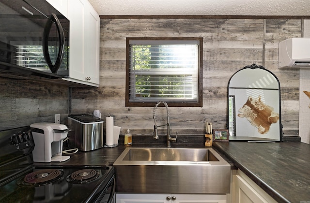 193 Sycamore, Sheridan, AR 72150 - kitchen featuring black appliances, a sink, dark countertops, white cabinets, and a wall mounted AC
