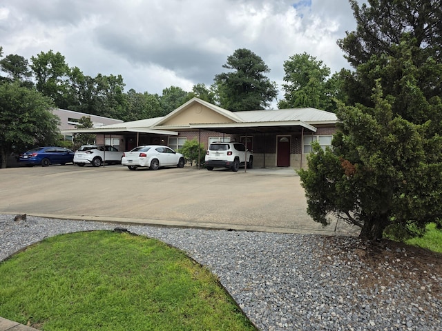 1615 Aldersgate Rd, Little Rock, AR 72205 - view of front facade featuring a carport and brick siding