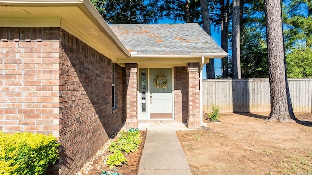 1715 Drury Ln, Conway, AR 72034 - doorway to property with brick siding and a shingled roof