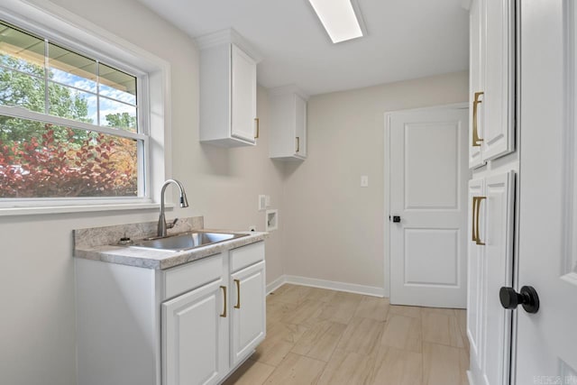 104 Dickson Dr, Little Rock, AR 72207 - washroom featuring cabinet space, hookup for a washing machine, and baseboards
