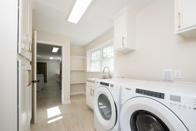 104 Dickson Dr, Little Rock, AR 72207 - laundry room featuring washer and dryer, cabinet space, and baseboards