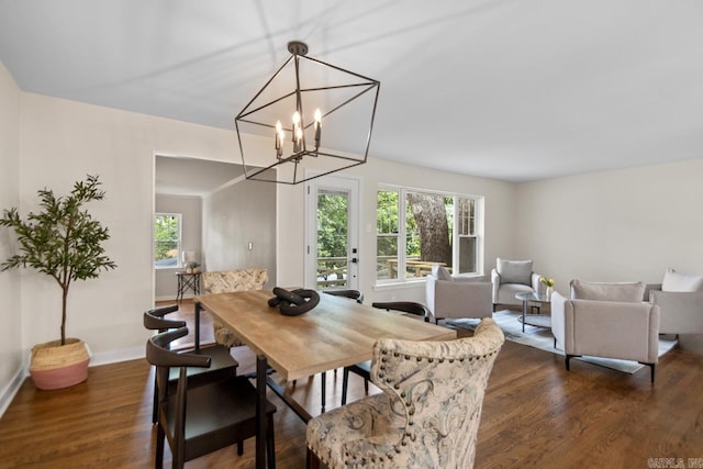 104 Dickson Dr, Little Rock, AR 72207 - dining room featuring healthy amount of natural light, dark wood-style floors, and a chandelier