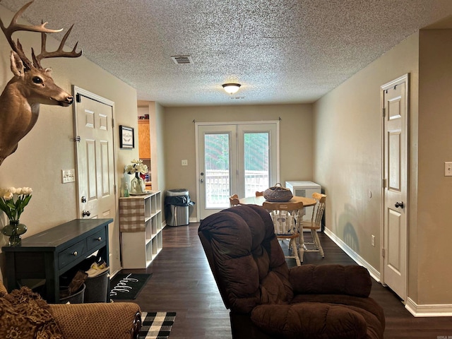 3537 W 26th Hwy, Arkadelphia, AR 71923 - living area with baseboards, a textured ceiling, and dark wood-type flooring
