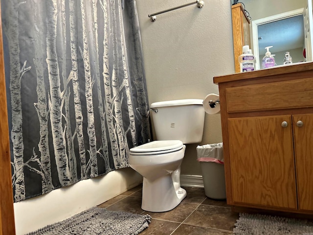 3537 W 26th Hwy, Arkadelphia, AR 71923 - bathroom featuring tile patterned flooring, vanity, toilet, and shower / bathtub combination with curtain