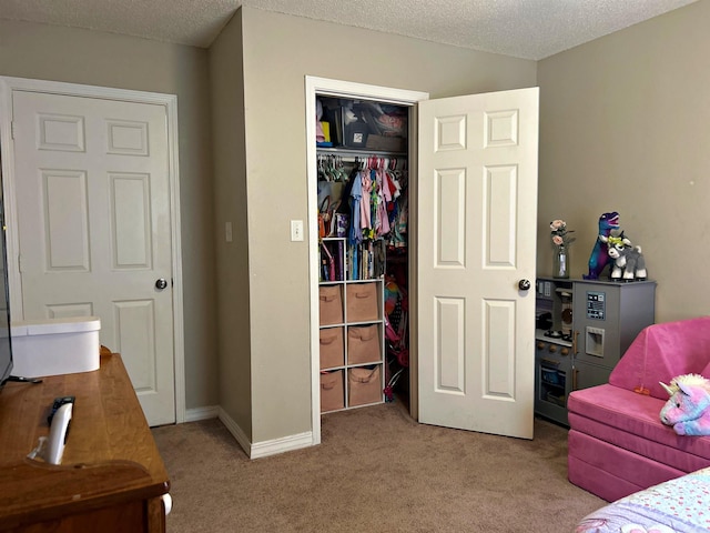 3537 W 26th Hwy, Arkadelphia, AR 71923 - bedroom featuring carpet flooring, a closet, a textured ceiling, and baseboards