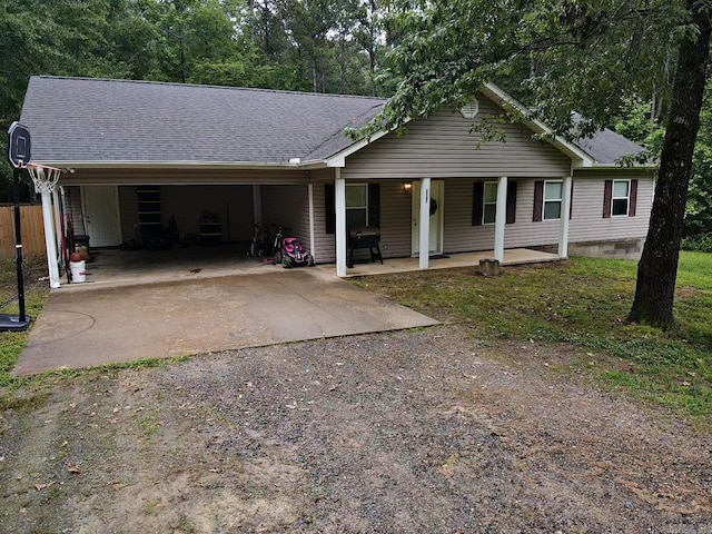 3537 W 26th Hwy, Arkadelphia, AR 71923 - ranch-style home featuring driveway, a carport, covered porch, and a shingled roof
