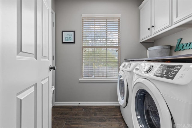 9 Westoak Cir, Little Rock, AR 72223 - washroom featuring washing machine and dryer, cabinet space, dark wood-type flooring, and plenty of natural light