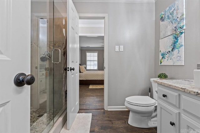 9 Westoak Cir, Little Rock, AR 72223 - full bathroom with vanity, wood finished floors, a stall shower, and toilet
