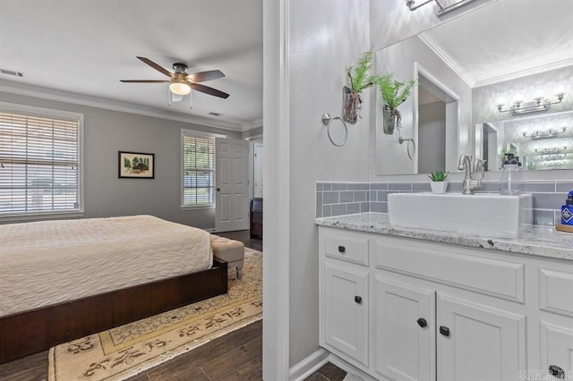 9 Westoak Cir, Little Rock, AR 72223 - bedroom featuring a sink, ornamental molding, dark wood-type flooring, baseboards, and ceiling fan