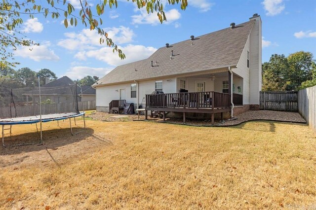 9 Westoak Cir, Little Rock, AR 72223 - back of house with a trampoline, a deck, and a chimney