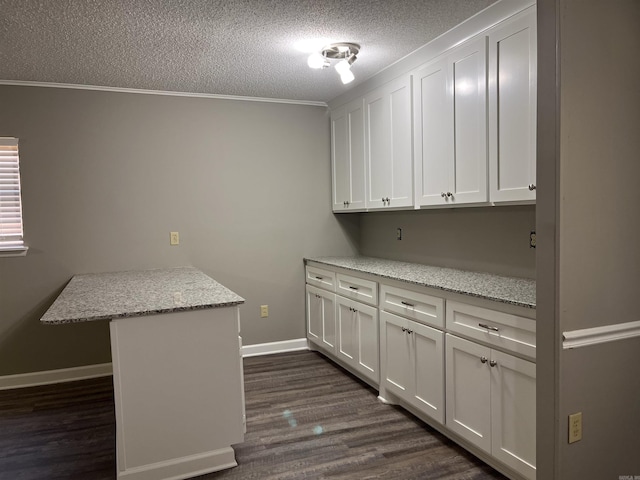 2411 Broadview Ave, Conway, AR 72034 - laundry room with a textured ceiling, dark wood-type flooring, baseboards, and crown molding