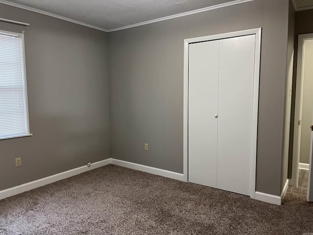 2411 Broadview Ave, Conway, AR 72034 - unfurnished bedroom with carpet, a closet, crown molding, and baseboards