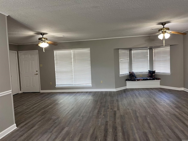 2411 Broadview Ave, Conway, AR 72034 - unfurnished living room featuring ceiling fan, dark wood finished floors, a textured ceiling, baseboards, and ornamental molding