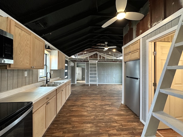 12017 Miller County 10, Fouke, AR 71837 - kitchen with appliances with stainless steel finishes, light brown cabinetry, a sink, light countertops, and vaulted ceiling
