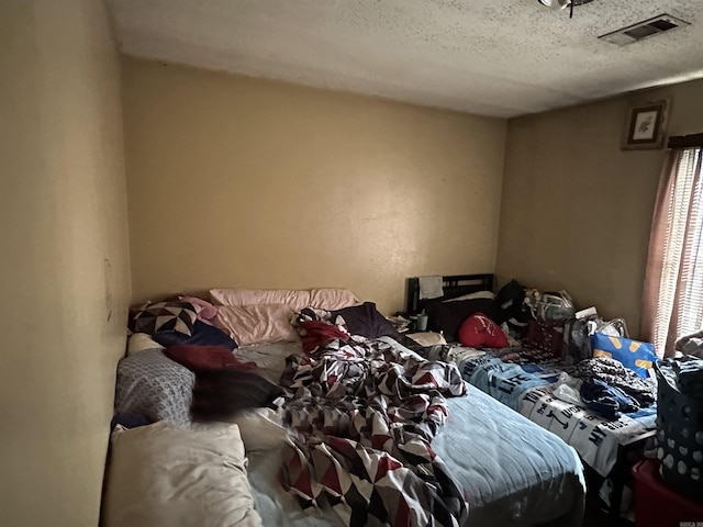 422 Mimosa Rd, North Little Rock, AR 72117 - bedroom with a textured ceiling