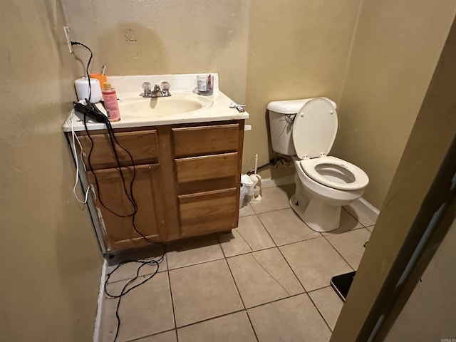422 Mimosa Rd, North Little Rock, AR 72117 - bathroom with tile patterned flooring, toilet, vanity, and baseboards