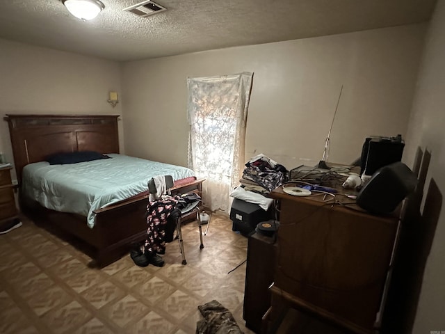 422 Mimosa Rd, North Little Rock, AR 72117 - bedroom featuring a textured ceiling and light floors