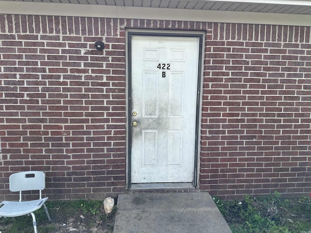 422 Mimosa Rd, North Little Rock, AR 72117 - view of exterior entry featuring brick siding